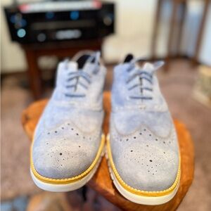 Cole Haan Zero Grand Light Blue Suede Oxfords with orange/yellow Accents.